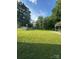 Wide shot of grassy backyard featuring storage shed at 3085 Faith Rd, Salisbury, NC 28146