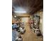 Unfinished basement with exposed beam ceiling, and storage shelving at 3085 Faith Rd, Salisbury, NC 28146
