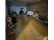 Large, unfinished basement featuring tile flooring, storage, and decorative figures at 3085 Faith Rd, Salisbury, NC 28146