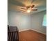 Bedroom with hardwood floors, a ceiling fan, and natural light from a window at 3085 Faith Rd, Salisbury, NC 28146