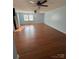 Bright bedroom featuring hardwood floors and ceiling fans at 3085 Faith Rd, Salisbury, NC 28146