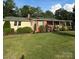 Lovely single-story brick home with an inviting covered porch and well-maintained yard at 3085 Faith Rd, Salisbury, NC 28146