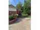 Back exterior view of home with covered porch and stairway to back yard at 3085 Faith Rd, Salisbury, NC 28146