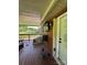 Enclosed porch with brick exterior and outdoor furniture at 3085 Faith Rd, Salisbury, NC 28146