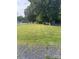 Grassy front yard with mature trees at 3085 Faith Rd, Salisbury, NC 28146
