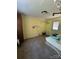 Bright laundry room with ceramic tile floors and ample space for storage or folding at 3085 Faith Rd, Salisbury, NC 28146