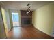 Inviting living room with a brick fireplace and decorative lighting fixture at 3085 Faith Rd, Salisbury, NC 28146