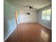 Open-concept living room features hardwood flooring, soft lighting, and a spacious layout at 3085 Faith Rd, Salisbury, NC 28146