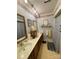 Bathroom featuring a vanity, framed mirrors, and floral wallpaper at 506 Hearne Farm Rd, Mount Gilead, NC 27306