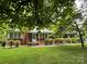 Charming single-story brick home with well-manicured landscaping and a freshly cut lawn at 506 Hearne Farm Rd, Mount Gilead, NC 27306