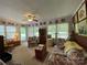 Bright living room with natural light and floral pattern sofas at 506 Hearne Farm Rd, Mount Gilead, NC 27306