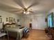 Spacious bedroom featuring hardwood floors and ample closet space at 506 Hearne Farm Rd, Mount Gilead, NC 27306