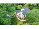 An aerial view of the house nestled among trees, showcasing landscaping and architectural details at 6639 Camp Creek Rd, Lancaster, SC 29720