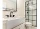 Modern bathroom featuring a sleek vanity, black fixtures, and a glass-enclosed shower at 6639 Camp Creek Rd, Lancaster, SC 29720