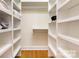 This walk-in closet provides generous storage space with custom shelves and hanging rods at 6639 Camp Creek Rd, Lancaster, SC 29720