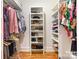 Organized walk-in closet with built-in shelving for clothing and accessories at 6639 Camp Creek Rd, Lancaster, SC 29720
