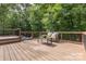 Inviting outdoor deck featuring comfortable seating, perfect for enjoying the tranquil wooded views at 6639 Camp Creek Rd, Lancaster, SC 29720