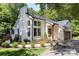 Renovated home featuring a painted brick exterior, new windows, manicured landscaping, and inviting curb appeal at 6639 Camp Creek Rd, Lancaster, SC 29720