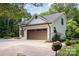 Two-car garage on a well-manicured lawn with an irrigation system at 6639 Camp Creek Rd, Lancaster, SC 29720