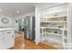 Kitchen featuring stainless steel appliances, ample cabinet space, and an organized pantry at 6639 Camp Creek Rd, Lancaster, SC 29720