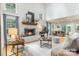 Bright and airy living room featuring a fireplace, hardwood floors, and ample natural light at 6639 Camp Creek Rd, Lancaster, SC 29720