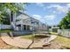 Expansive backyard with a trampoline, patio, and lush green landscaping at 6930 Culloden More Ct, Charlotte, NC 28217
