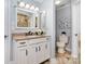 Bathroom featuring vanity with granite countertop, decorative mirror, and a toilet at 6930 Culloden More Ct, Charlotte, NC 28217