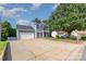 Two-story home with blue siding, two car garage, and long driveway with landscaping at 6930 Culloden More Ct, Charlotte, NC 28217