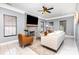 Comfortable living room with stone fireplace, ceiling fan, and natural light at 6930 Culloden More Ct, Charlotte, NC 28217