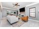 Cozy living room with a stone fireplace, ceiling fan, and comfortable seating arrangement at 6930 Culloden More Ct, Charlotte, NC 28217