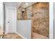 Shower featuring decorative tile, shower head, and glass enclosure at 6930 Culloden More Ct, Charlotte, NC 28217