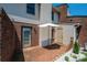 Backyard brick patio with an umbrella and landscaping at 709 21St Ne Ave, Hickory, NC 28601