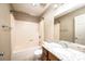 Bathroom featuring a shower-tub combo, granite counters and ample lighting at 709 21St Ne Ave, Hickory, NC 28601