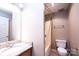 Bathroom featuring a shower-tub combo, and granite counters at 709 21St Ne Ave, Hickory, NC 28601