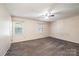 Bedroom with carpet, ceiling fan, and windows at 709 21St Ne Ave, Hickory, NC 28601