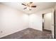 Bedroom featuring neutral paint, carpet, a ceiling fan, and door to walk in closet at 709 21St Ne Ave, Hickory, NC 28601