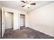 Bedroom featuring neutral paint, carpet, a ceiling fan and a closet at 709 21St Ne Ave, Hickory, NC 28601