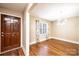 Inviting dining room boasts hardwood floors, a modern chandelier, and a window with curtains at 709 21St Ne Ave, Hickory, NC 28601