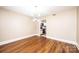Open dining area showcasing hardwood floors, modern lighting, and an open view into the adjacent kitchen at 709 21St Ne Ave, Hickory, NC 28601