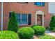 Up-close view of brick facade with black shutters and green landscaping at 709 21St Ne Ave, Hickory, NC 28601