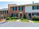 Brick townhouse with black shutters, manicured bushes, and parking at 709 21St Ne Ave, Hickory, NC 28601