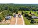 Birds eye view of new construction homes surrounded by trees and green spaces at 1019 S Main St, Granite Quarry, NC 28146