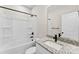 Well-lit bathroom featuring a tub-shower combo with black fixtures, and a granite countertop at 1019 S Main St, Granite Quarry, NC 28146