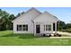 Charming home with a black front door, black shutters, and manicured lawn at 1019 S Main St, Granite Quarry, NC 28146