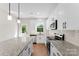 Modern kitchen with granite counters, stainless appliances, and bright natural light at 1019 S Main St, Granite Quarry, NC 28146