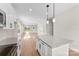 Bright, modern kitchen with granite island, stainless appliances, and open floor plan at 1019 S Main St, Granite Quarry, NC 28146