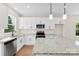 Contemporary kitchen featuring granite counters, stainless appliances, and ample cabinet space at 1019 S Main St, Granite Quarry, NC 28146