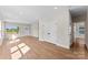 Spacious living room with wood-look flooring, natural light, and convenient closet space at 1019 S Main St, Granite Quarry, NC 28146