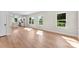 Bright, open-concept living space with light wood floors and plenty of natural light at 1019 S Main St, Granite Quarry, NC 28146