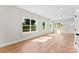 Bright living room featuring wood-look floors and large windows offering scenic outdoor views at 1019 S Main St, Granite Quarry, NC 28146